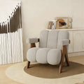 Cream boucle barrel accent chair with solid wood legs